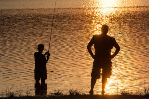 father-and-son-fishing-at-sunset-aaron-baker