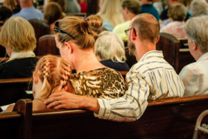 Family Sitting Together in Church