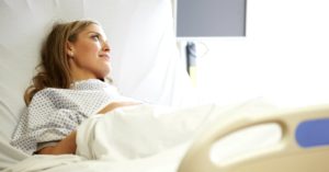 sick woman hospital bed