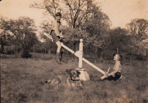 two boys 1800s seesaw